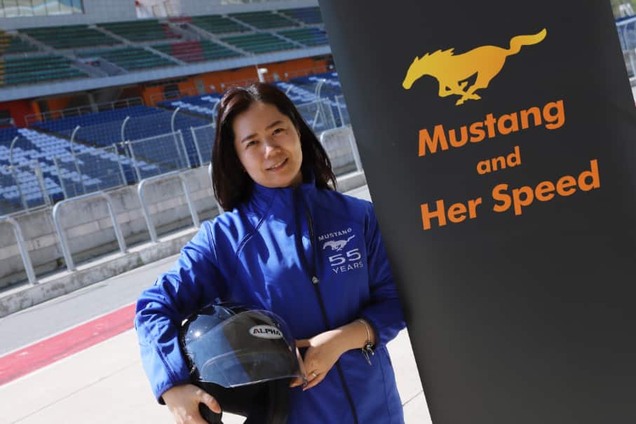 Yong-unnie Poses Beside Mustang and Her Speed Banner Yong-unnie Poses Beside Mustang and Her Speed Banner